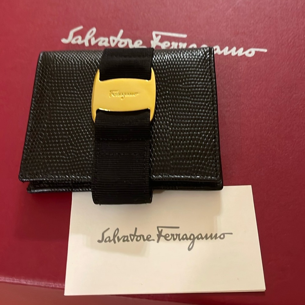 Black ferragama wallet with gold snap beautiful condition used once